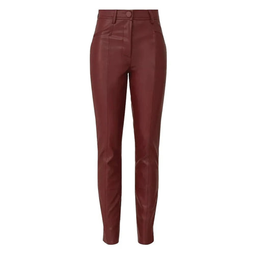 Maroon leather pants on a white background