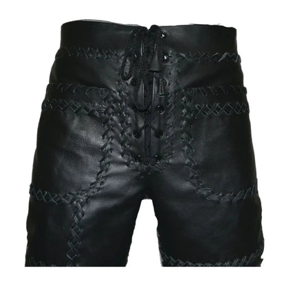 Black leather shorts with intricate stitching on a white background