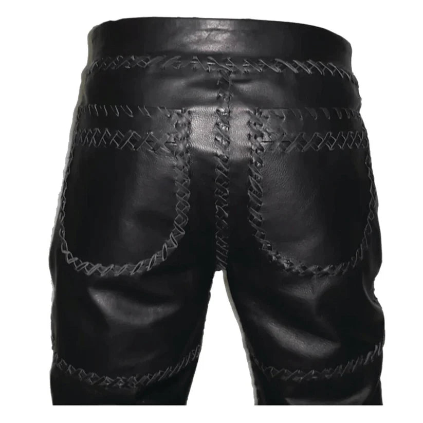 Black leather shorts with intricate stitching on a white background