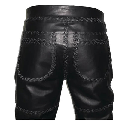 Black leather shorts with intricate stitching on a white background