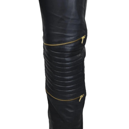 Black leather leggings with gold zippers on a white background