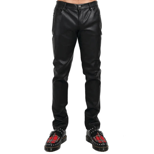 Black leather pants worn by a person on a white background