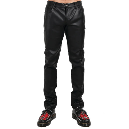 Black leather pants worn by a person on a white background