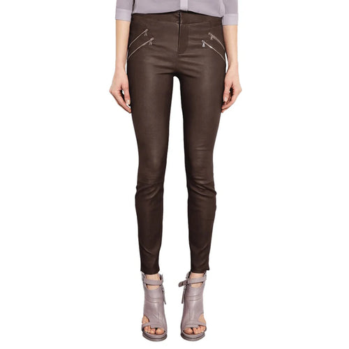 Brown leather pants worn by a person on a white background