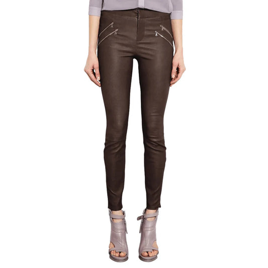 Brown leather pants worn by a person on a white background