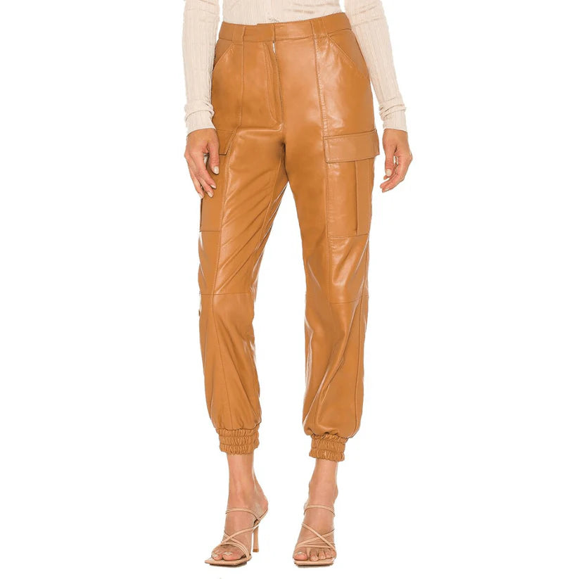 Tan leather jogger pants worn by a model on a white background