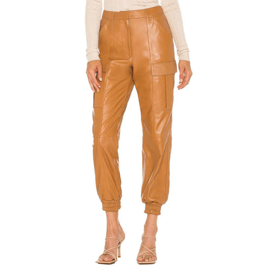Tan leather jogger pants worn by a model on a white background